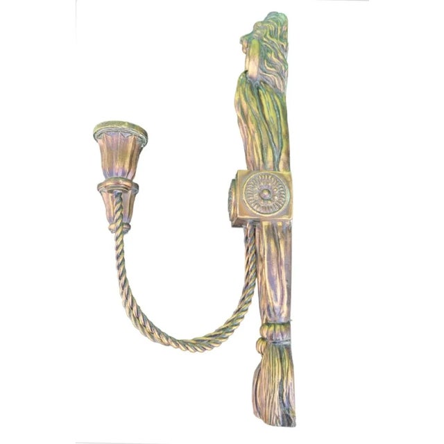 A pair of vintage very heavy lions head, tassel double arm candle holders. The holders I believe are made of a plaster...