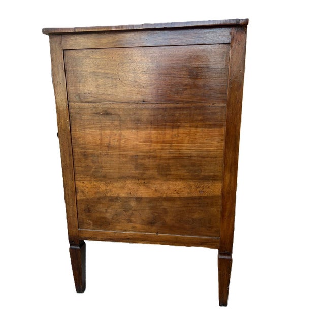 louis xvi inlaid walnut chest of drawers, early 19th century height: 93 cm width: 121 cm depth: 60 cm This piece has an...
