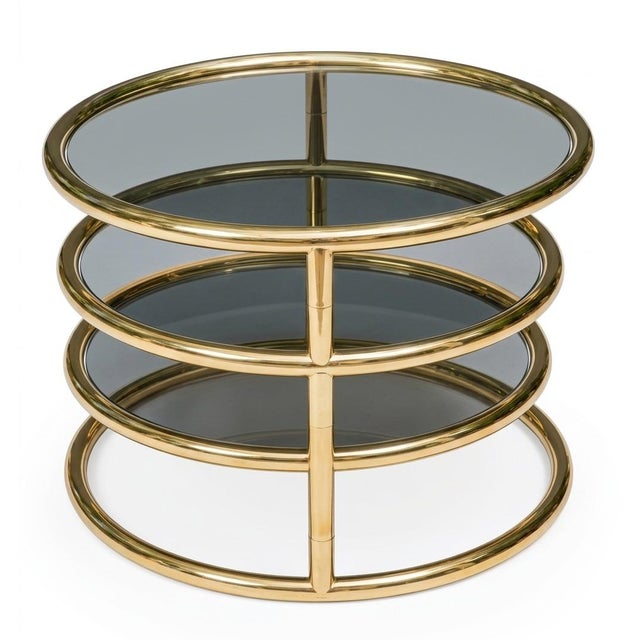 1970s Milo Baughman style Tubular brass and dark Smoked Glass Swiveling Coffee Table. A Cocktail Table that transforms...