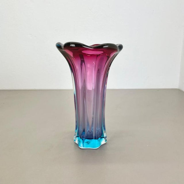 This original vintage glass vases was designed and produced in the 1970s in Murano, Italy. It is made of heavy murano...