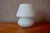 This bedside lamp or night light is made of stunning opaline glass, shaped like a bulbous mushroom. It diffuses a soft...