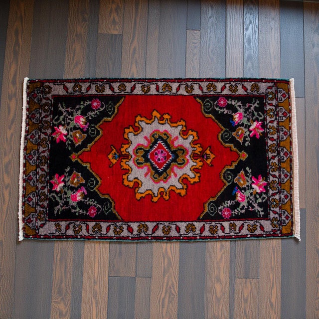 Welcome to our curated collection of Anatolian textiles. This captivating hand-knotted small rug brings authentic vintage...