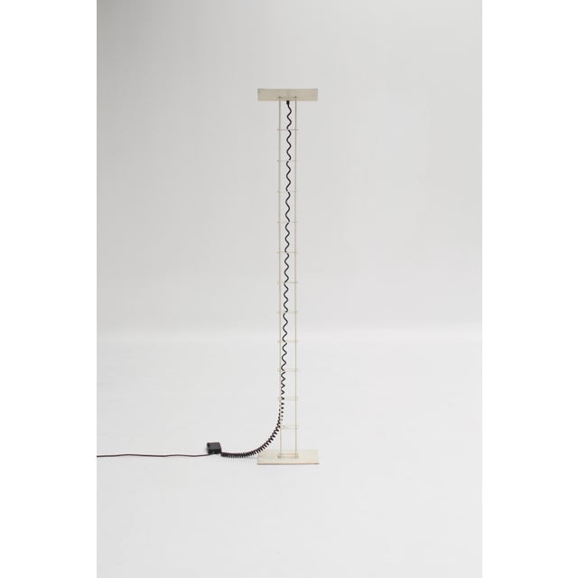 Designed by Arelux in Italy in the 1980s, this minimalist floor lamp captivates with its slender silhouette and indirect...