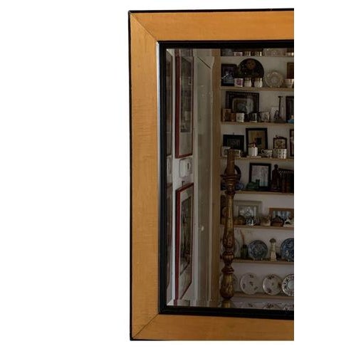 A handsome french birch mirror with a smart ebonised edge to the frame from the early 1900s. The mirror is bevelled and...