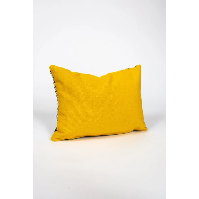 This modern pillow is bright yellow on one side, with black + white woven fabric on the other. Measures 12"x16" and comes...