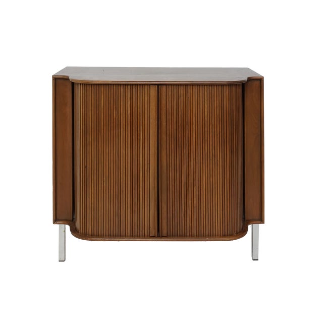 There's nothing more satisfying then sliding open and closed this cabinet's tambour door. It glides seamlessly and...