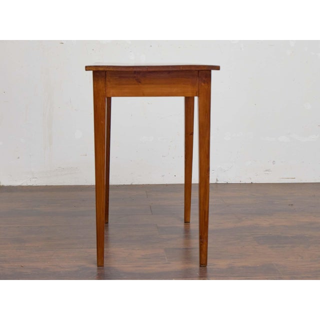 A 19th century English pine table, notable for its simplicity and authentic country house character. The rectangular top...