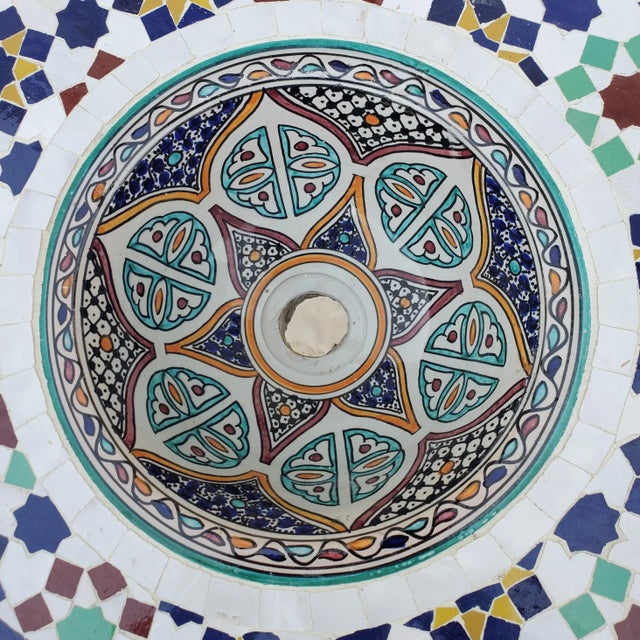 Handmade Moroccan ceramic sink bowl and mosaic tile counter top. Color is blue, white, aqua and mustard. A particularly...