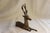 Vintage brass deer figurine with delicate mid century detailing, perfect for adding an elegant vintage touch to your...