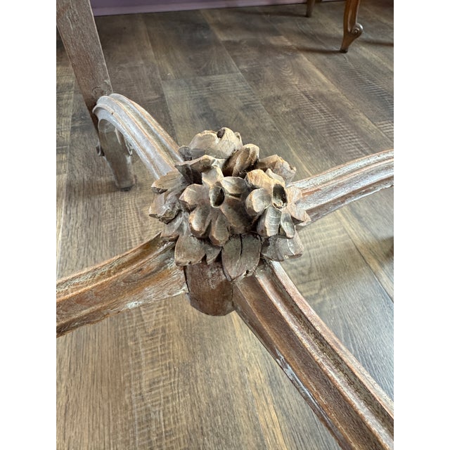 French Style Side Table, dating back to the early 20th Century. It is crafted from Walnut and features intricate carvings...