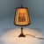 Lovely table with brass foot and a special lamp shade with hunting scenes. Small screw fitting, E14. 1960’s. In good...