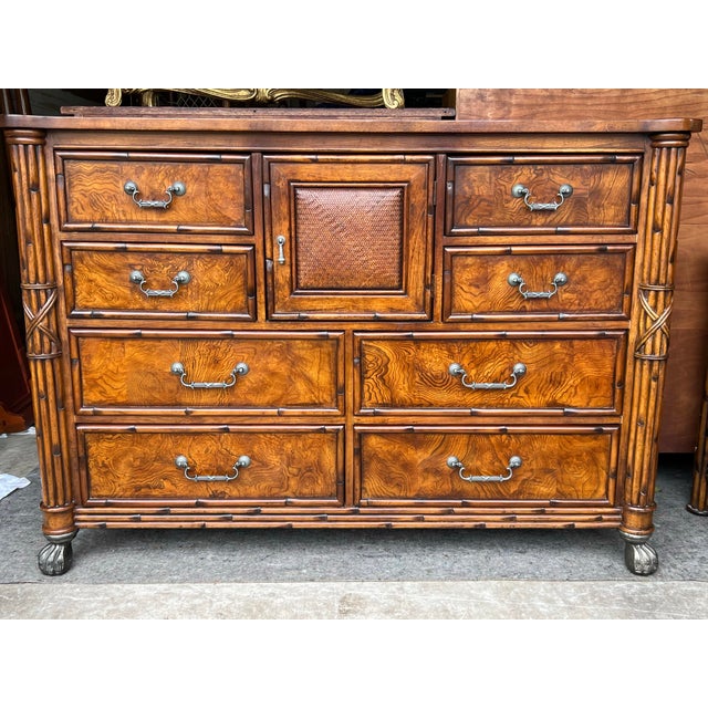 Stunning American Signature West Indies Collection faux bamboo tall dresser with woven rattan sides and granite top. This...