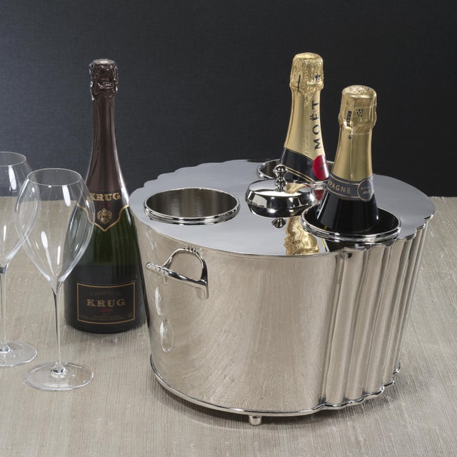 An exquisite blend of brass and steel, this shiny nickel-finished wine cooler is designed for both function and...