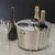An exquisite blend of brass and steel, this shiny nickel-finished wine cooler is designed for both function and...