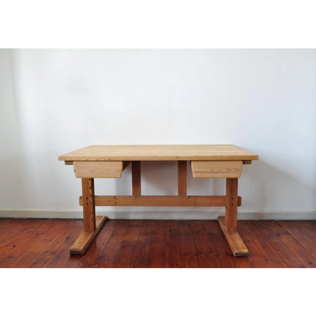 Danish desk in solid pine wood with two drawers. Fine craftsmanship. Fronted by two large storage drawers, inner...