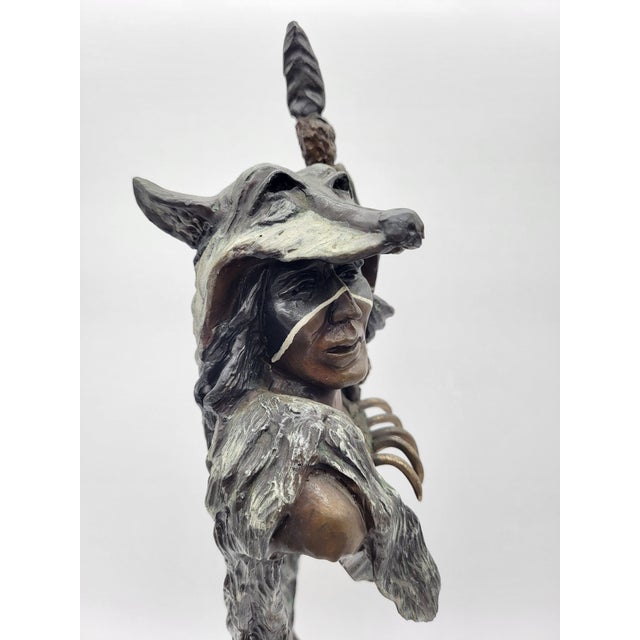 Elevate your collection with this striking, rare patinated bronze bust titled "Crazy Dog" by acclaimed Montana Western...