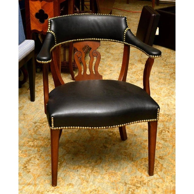 Modern English mahogany and leather captains chair, of typical form with subtle details, custom calfskin leather...