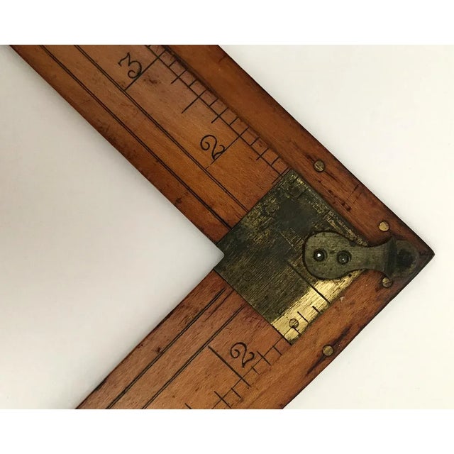 Antique right angle ruler made in New York City by S. T. Taylor, Broadway New York. Embossed ruler with brass accents is...