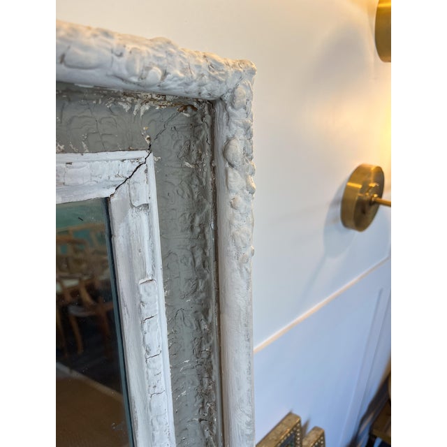 This charming mirror is a simple way to expand any space. The double panels capture the trumeau essence while the white...