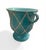 This decorative cachepot or urn features a vibrant, high-gloss turquoise glaze that gives it a rich, Mediterranean feel....