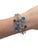 Consisting of four round mixed cut blue topaz measuring approximately 10.00 mm round, two round mixed cut iolites...