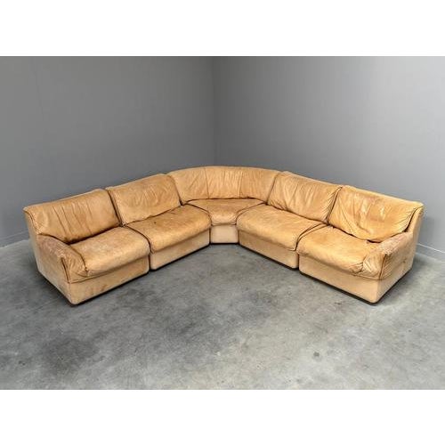 Remarks: Mid century elements sofa by COR, Germany 1970s. 5 Elements upholstered with camel color leather. All elements in...