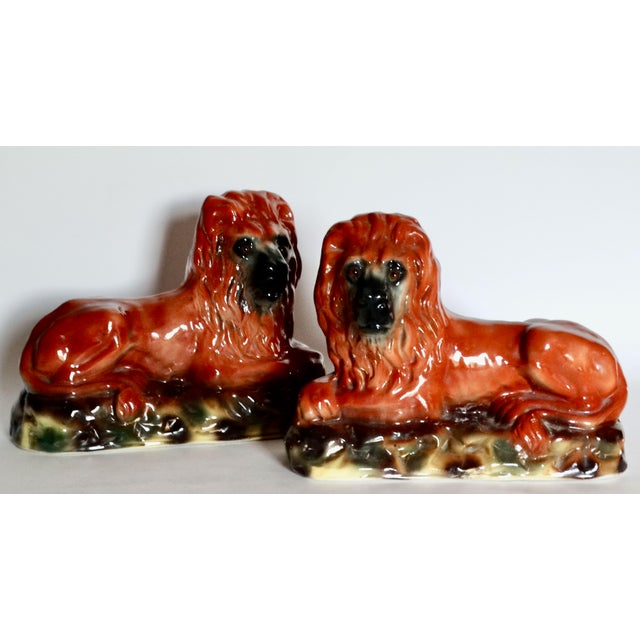 Large 19th-Century English Victorian era Staffordshire recumbent lions with glass eyes. These antique statement size...