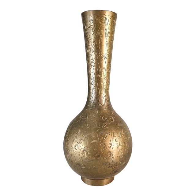 This mid-century Indian brass vase is formed with an elongated neck and rounded bulbous body, fully hand-etched with...