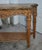 Vintage (2000's) Ornate Console Table has a Tuscan Style. Made of Wood. Carved & Inlaid Wood. Bottom Shelf. The...