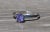 The Averie Ladies 14K Solitaire Engagement Style Ring set with 0.65 CT Tanzanite. Crafted in desirable 14 karat white...
