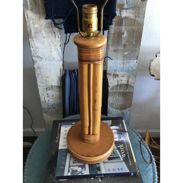Wonderful vintage lamp made from rattan and wood. Alternating large and small rattan make for a unique base as does the...