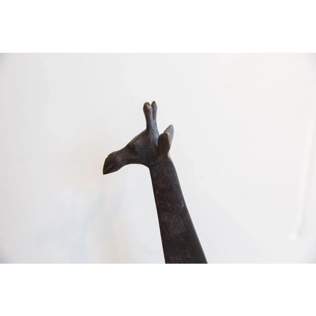 :: Vintage handmade African giraffe with dark patina. Made approximately 40-70 years ago, each figure in this collection...
