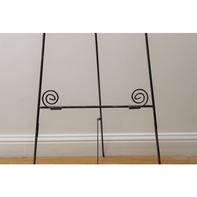 C. 20th century. Wrought iron easel w/ adorable swirl design.