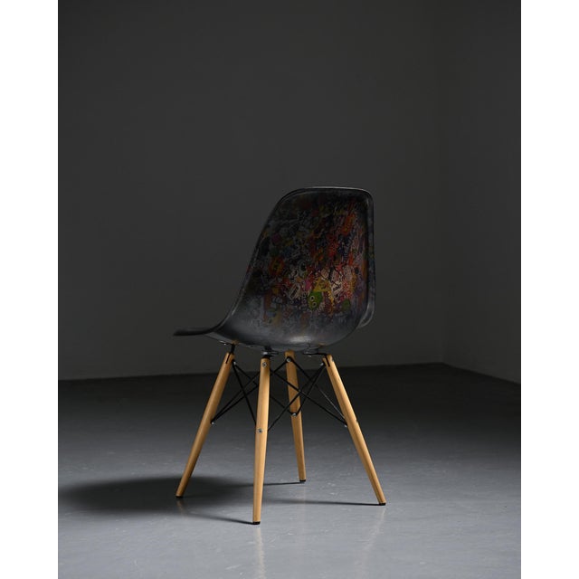 Eames chair featuring an artist intervention subsequently entirely covered with a new layer of transparent resin. The...