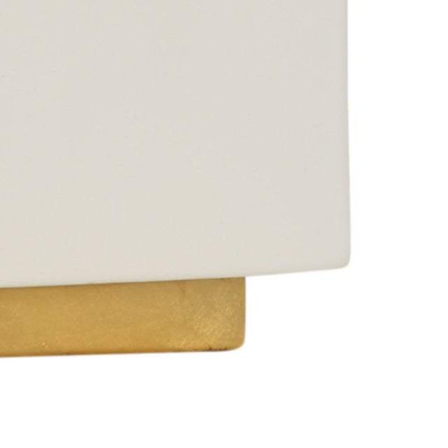 Snow glaze on ceramic with antique gold leaf mounting 32.5h x 7.5w x 7.5d Shade Dimensions: top(13 x 13) bottom(15 x 15)...