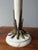 The proportions make these lamps instantly recognizable. A heavy alabaster base, a slender column, and atop it a large...