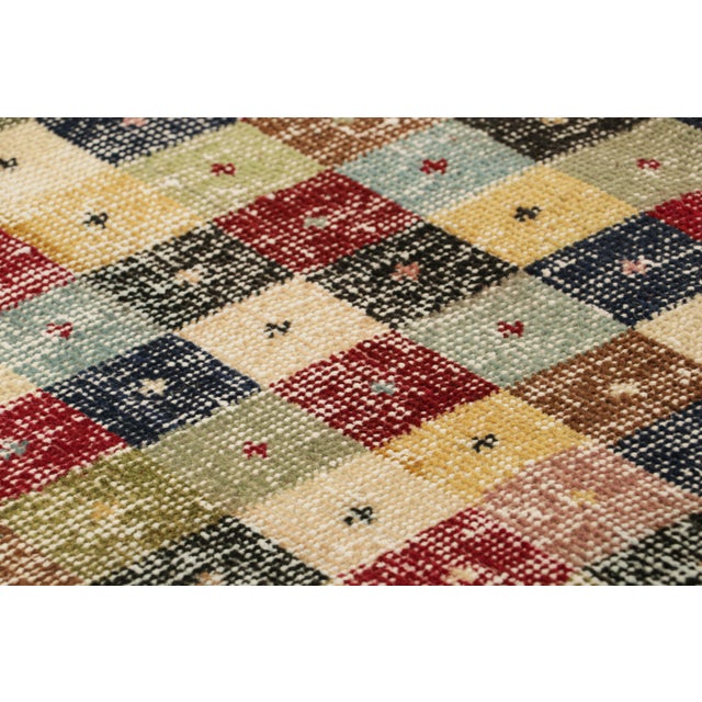 Hand-knotted in wool and originating from Turkey circa 1960 – 1970, this 2x6 vintage Zeki Müren runner is a unique...