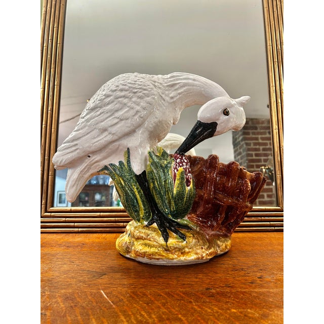 A striking mid-20th century Italian majolica planter or cache pot depicting a graceful wading bird—likely a swan standing...