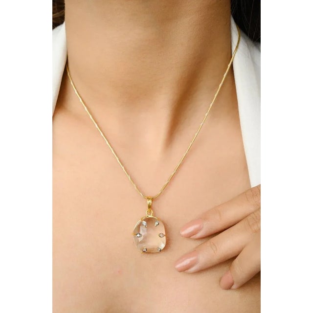 This is part of Chairish’s Fine Jewelry assortment. Huge Crystal and Diamond Pendant in 14K Gold studded with uneven cut...