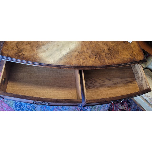 Super quality chippendale style 5 drwer dresser by Lloyd Buxton Furniture. Features burlwood veneer, sold oak frame and...