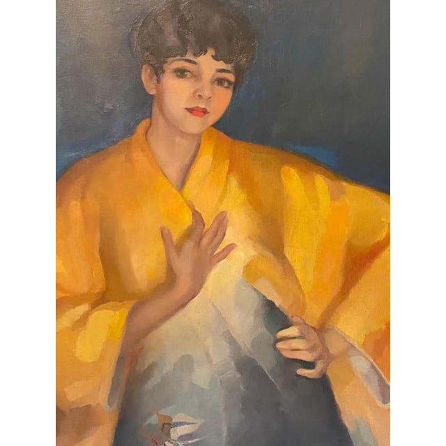 A woman with red lipstick, wrapped in a golden kimono, stands with a slight sway of her hips, her silhouette emerging from...