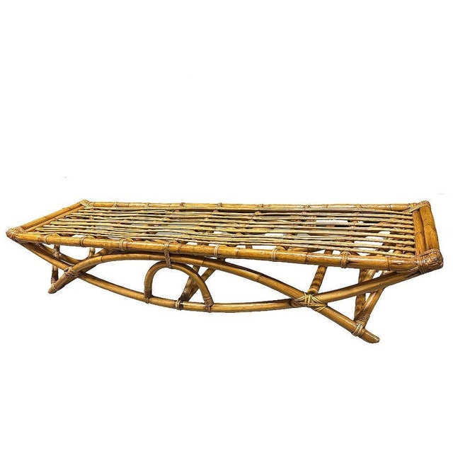 Rare, museum-quality rattan three-seat "Eye" bench features a reed rattan top and a captivating eye-shaped arch. Designed...