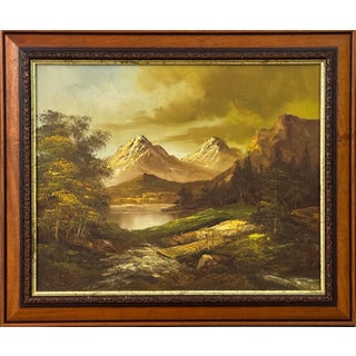 Golden mountain peaks rise above a quiet river where light and solitude meet 1975 Circa For Sale