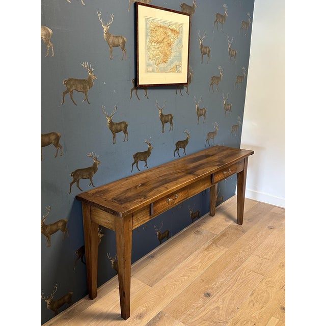 Beautiful antique walnut console table with 2 drawers. In very good condition throughout. The walnut wood has a lovely...