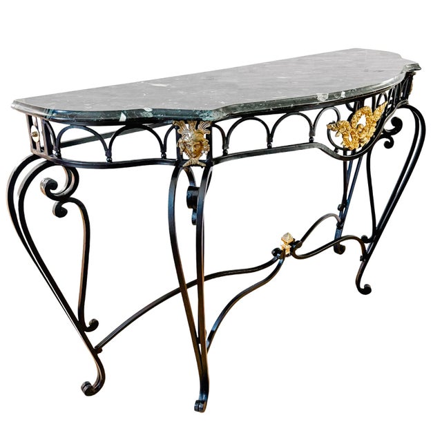 A striking Neoclassical French Empire style console with a contoured serpentine silhouette. Features a thick, beautifully...