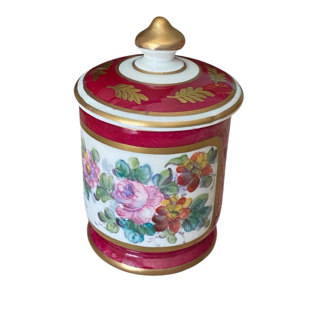 Antique hand painted porcelain jar with original lid made in Paris, France during the late 19th century. Painted in...