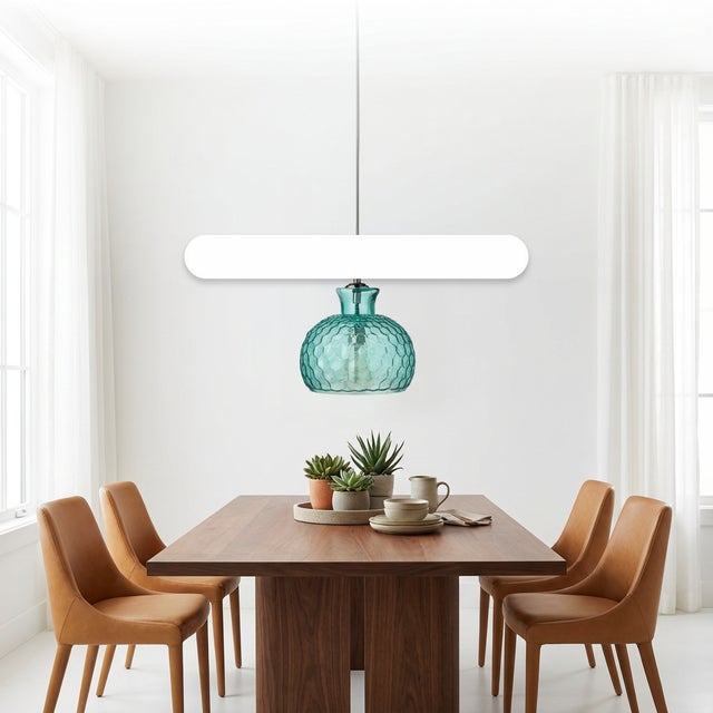 Introduce fresh style to any space with this Coastal Style Blue Textured Glass Clark Pendant. Featuring an aqua honeycomb...