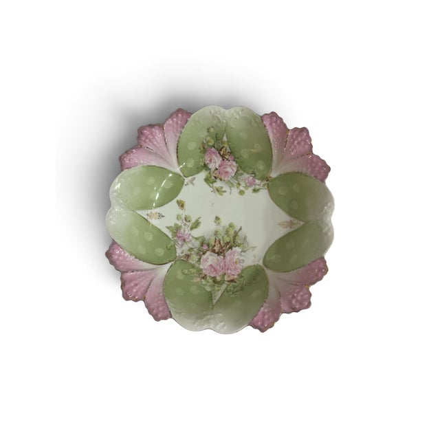 Charming porcelain decorative bowl featuring an elaborate sculptural scalloped design reminiscent of overlapping flower...