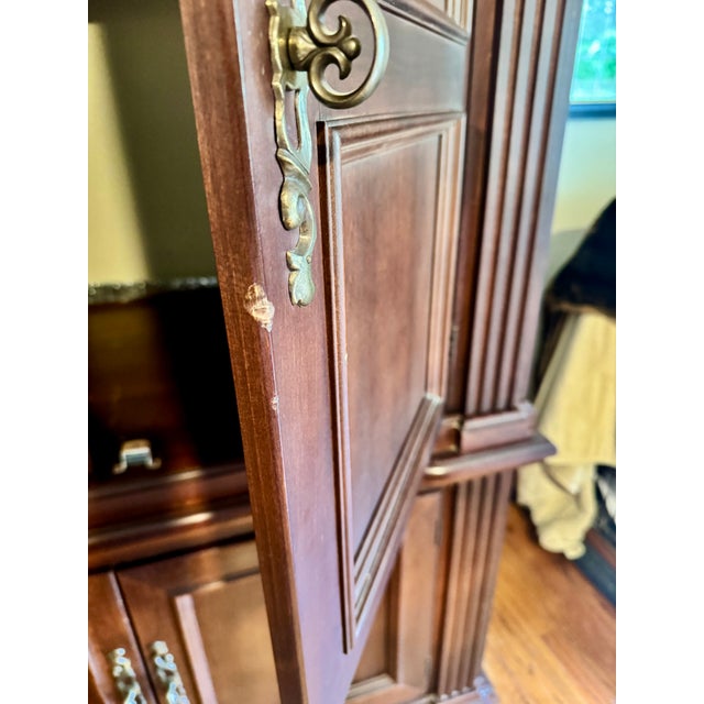 Hooker, solid cherry tv cabinet from the early 2000s. There is an electrical plug with cord inside. Max volt.120 Max. Amp....