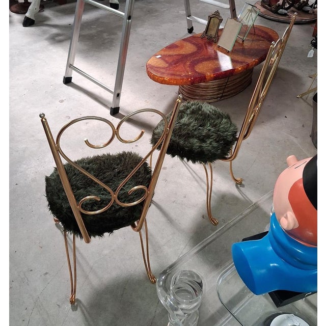 Pair of gilt metal chairs, Maison Jansen style, 1970s Dimensions: Height: 93 cm Width: 40 cm Depth: 38 cm An elegant pair...